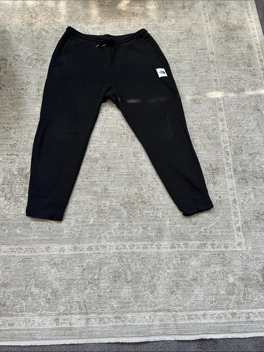 The North Face Men’s Large duo of one gray sweatpants and one black jogger.
